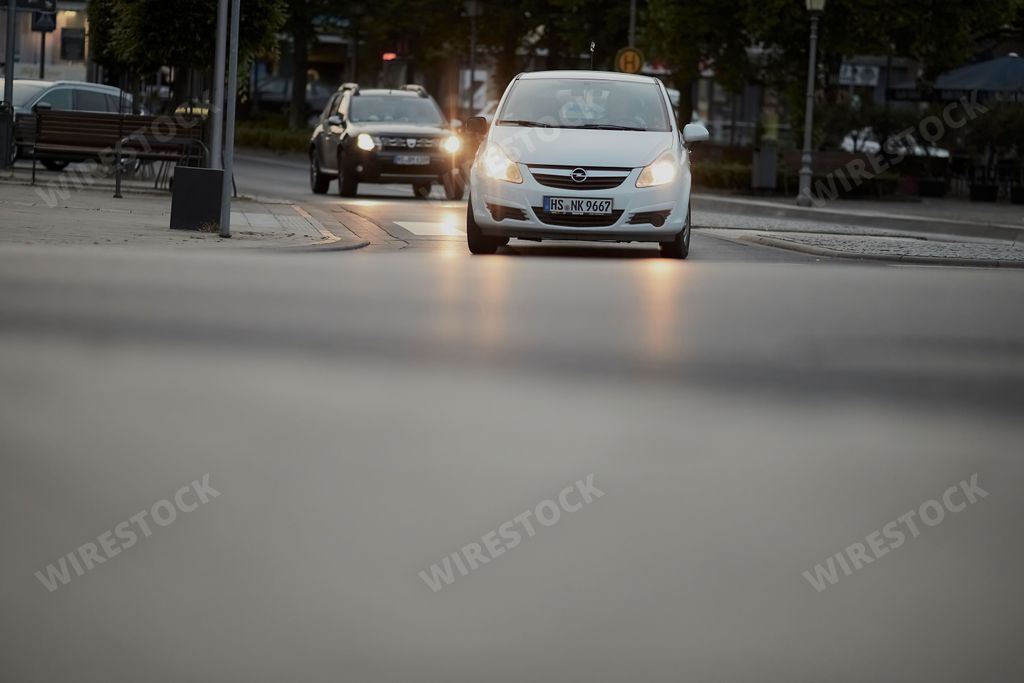 A busy road with cars riding through an intersection in Geilenkirchen, Germany