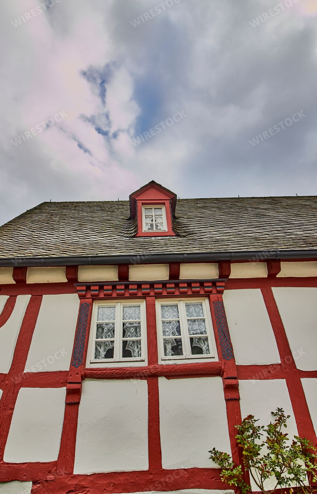 A beautiful exterior building with windows in the old village Monreal buildings, Germany with gray sky