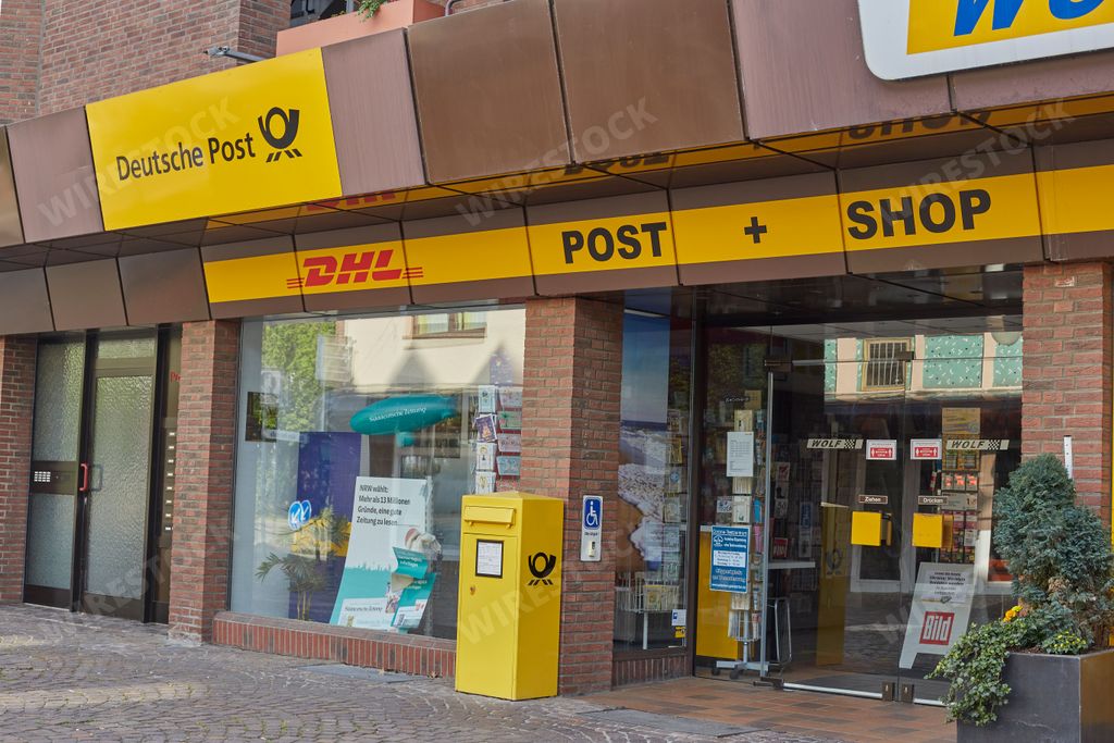 A closeup of the entrance of a german post DHL branch in Germany