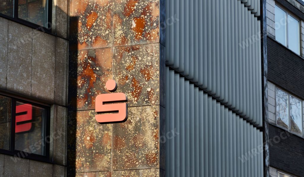 The logo of the Sparkasse bank on a brick wall in the city of Aachen, Germany