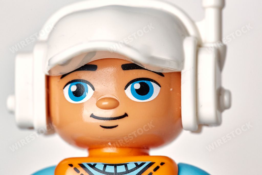 A construction worker with ear protection and radio equipment from lego Duplo