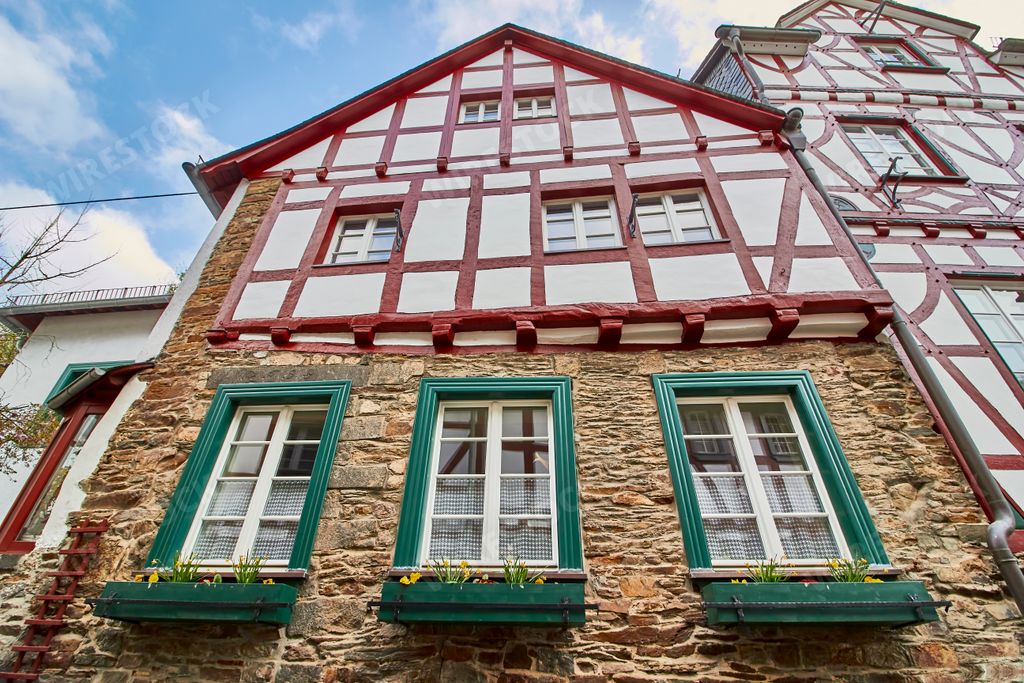 A low angle shot of a house with red lines in Monreal, Eifel region, Germany