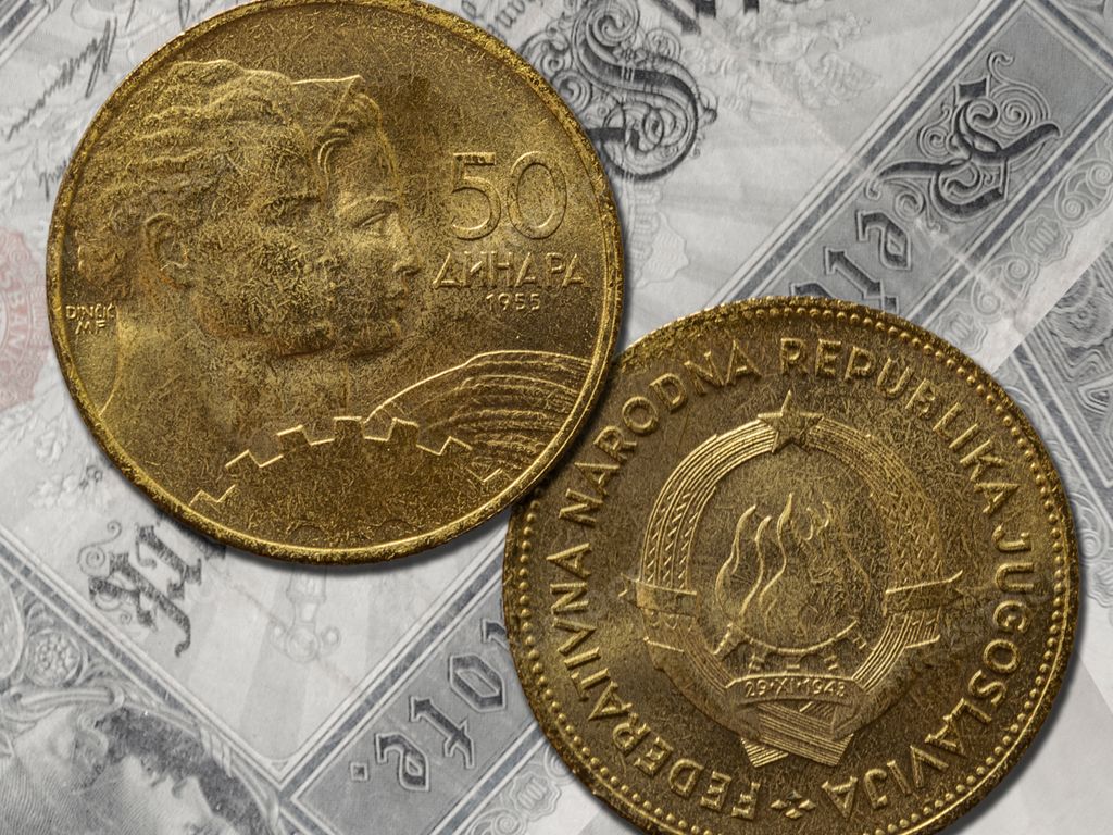 A vintage Yugoslav dinar coins of Kingdom and Federal Republic of Yugoslavia on the table
