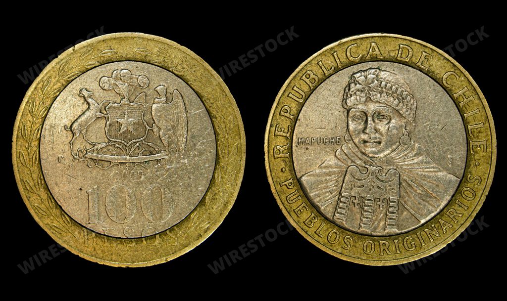Two coins side by side featuring the head of the Pope: Chilean 100 pesos coin