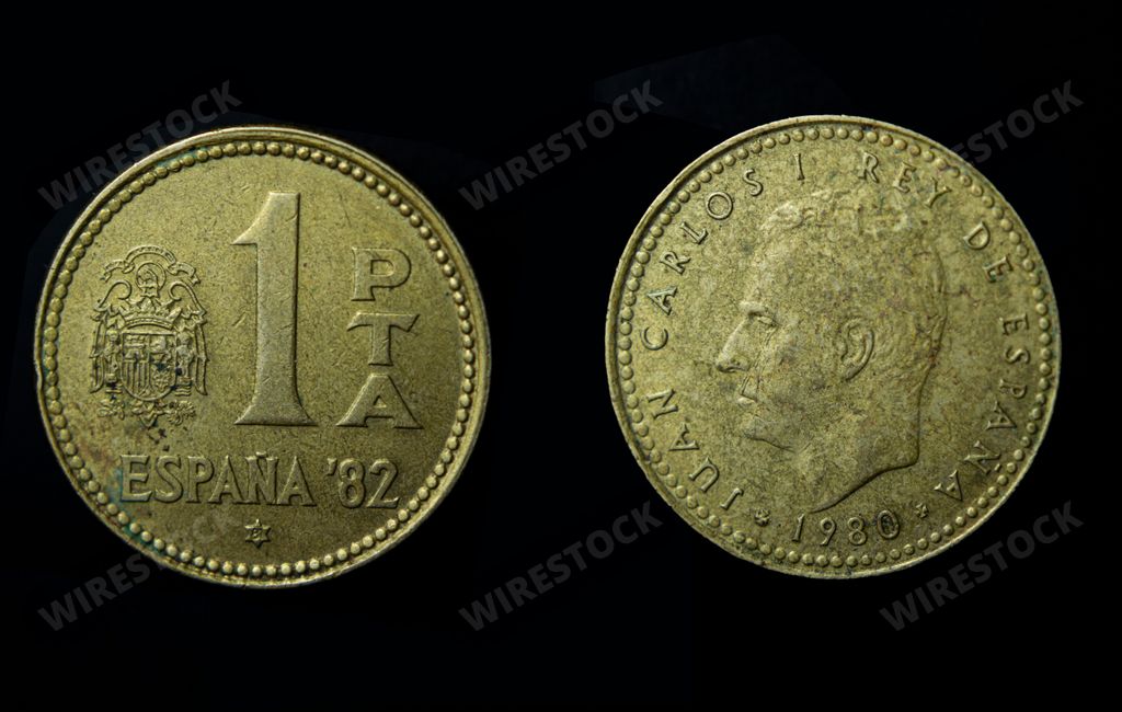 A closeup of Spanish peseta, Juan Carlos I on a dark background