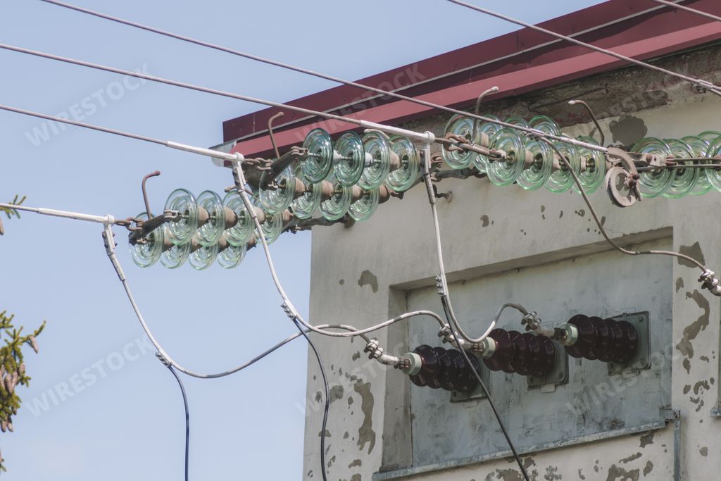 A closeup of power line insulators during daylight