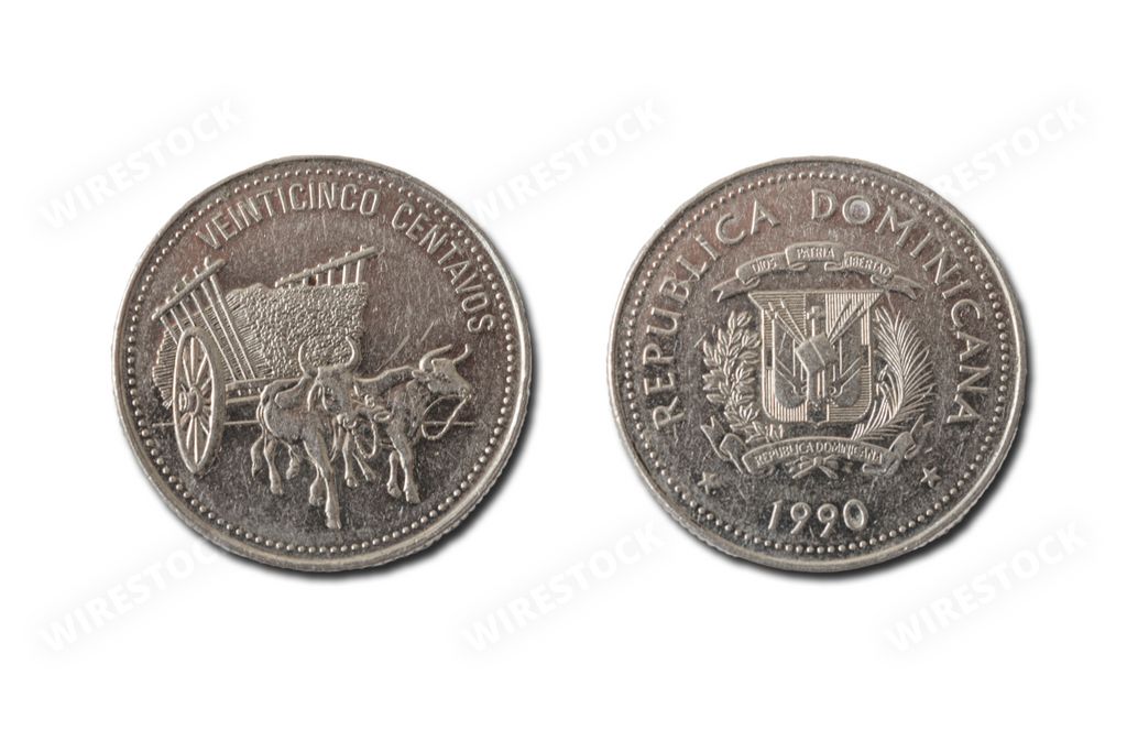 A close-up shot of two Dominican Republic coins lying side-by-side on a white background.