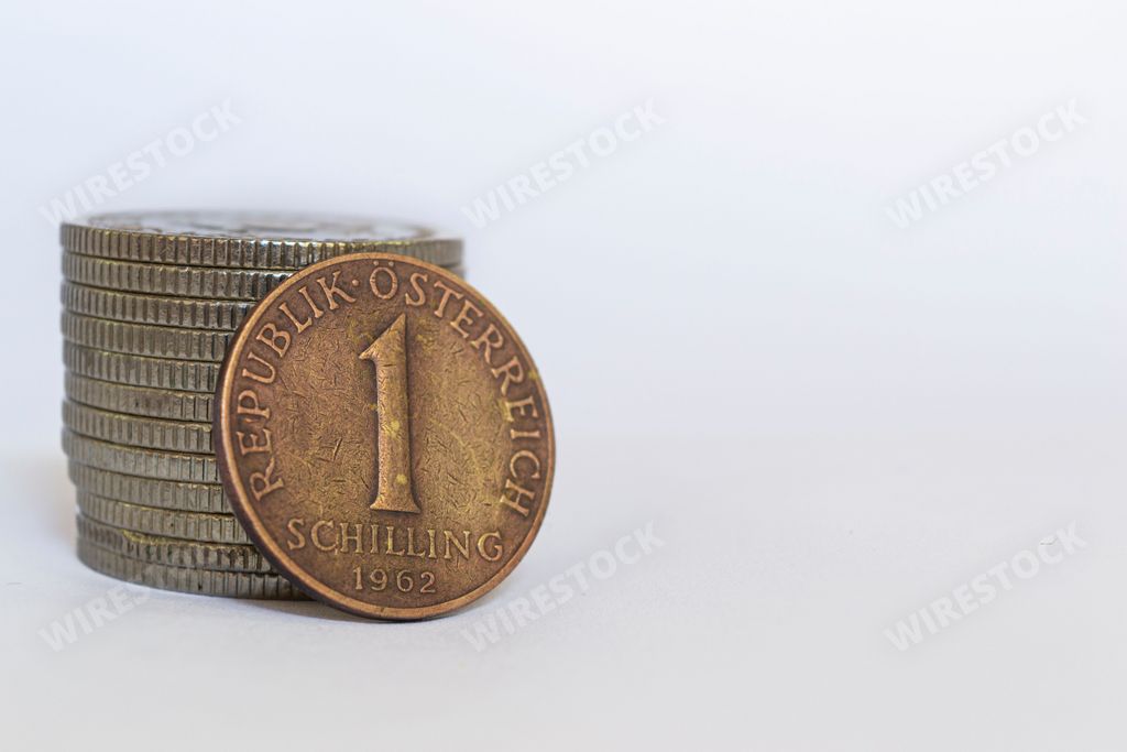 A closeup of Austrian 1 schilling coin on a white background