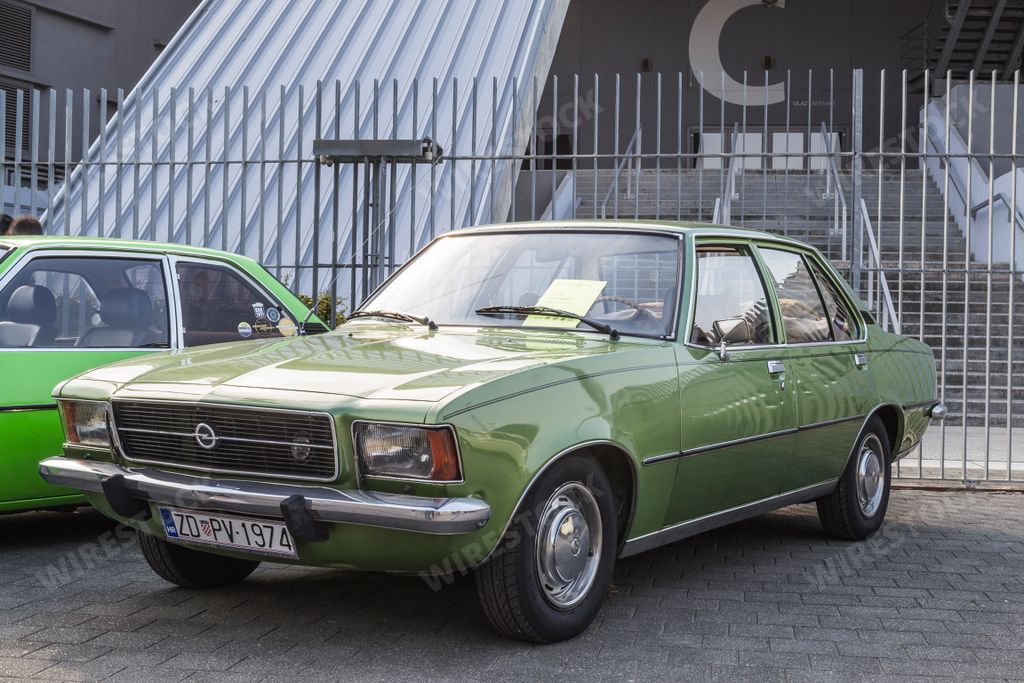 A green Opel Rekord car, displayed at a classic car exhibition in Zadar, Croatia