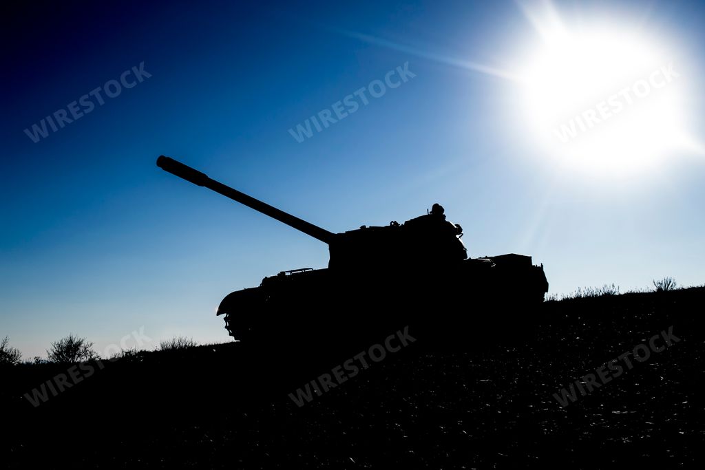 Silhouette of a russian made main battle tank on a battlefielf