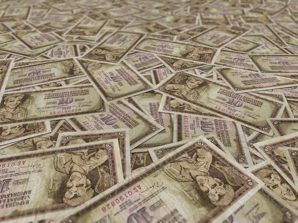 A background of historical Yugoslavian dinar banknotes or textile print