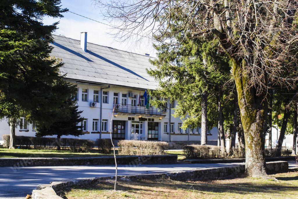 A park with trees in front of the Townhall in Gracac Croatia
