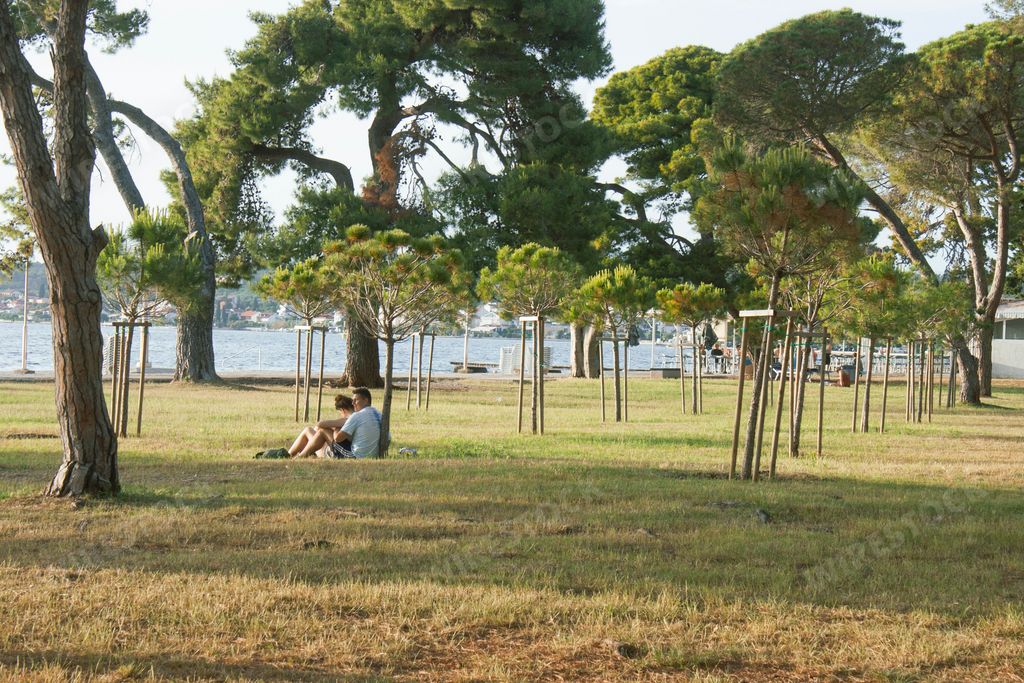 A beautiful view of people resting on the Borik beach in Dalmatia, Croatia