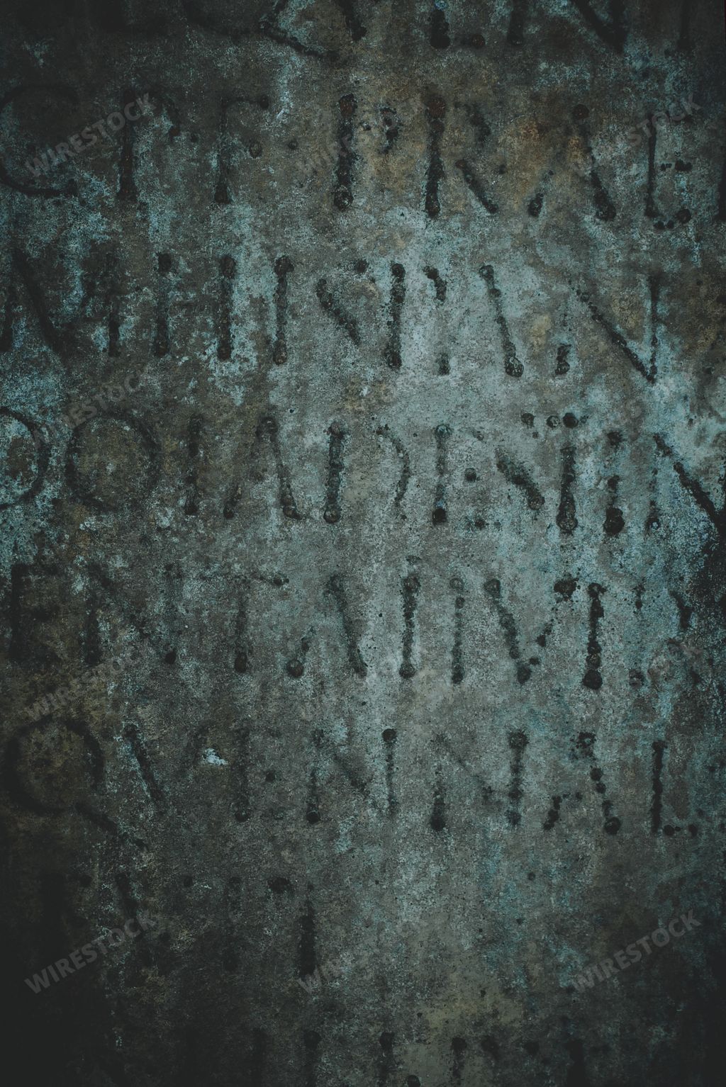 An ancient Roman text carved in stone, background or book cover