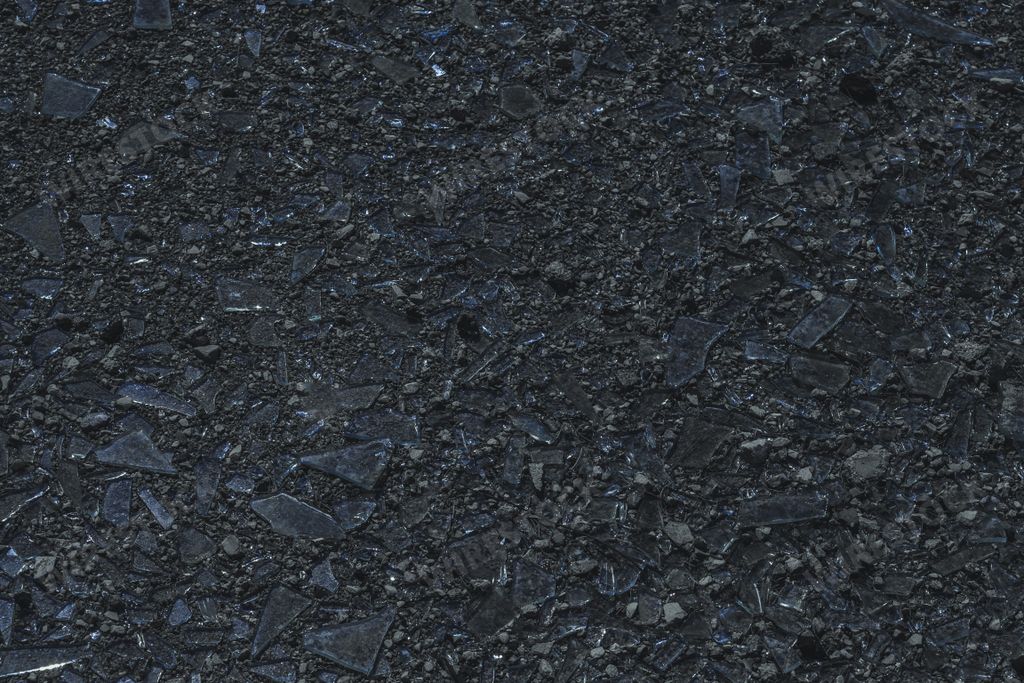 A closeup shot of broken glass pieces on ground