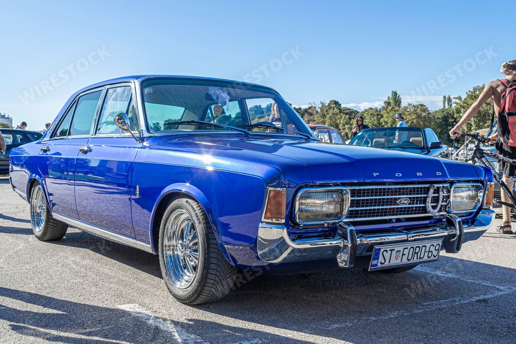 A classic old-timer Ford Taunus sedan 20M car from 1969 outdoors in sunny weather