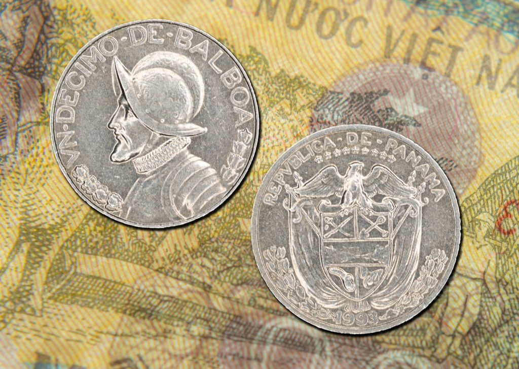 An AI generated illustration of Close-up of Panamanian coins on colorful banknotes background