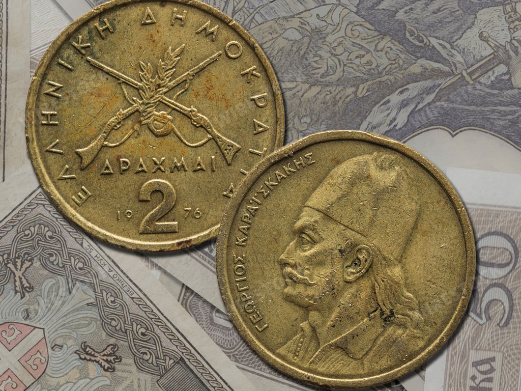 Both sides of vintage Greek drachma coins.  Old currency before euro