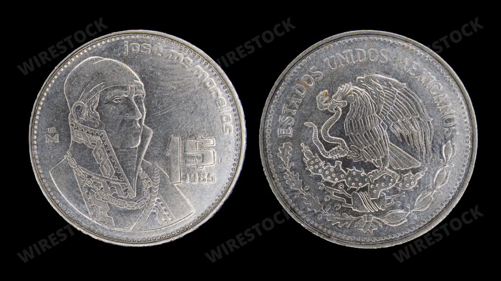 A close-up of a 1985 Mexican peso coin with Jose Maria Morelos and the Mexican coat of arms