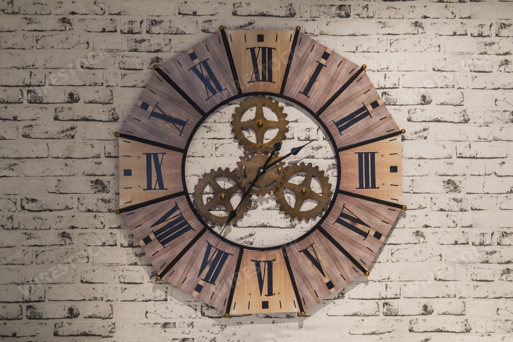 A closeup shot of aged bronze wall clock