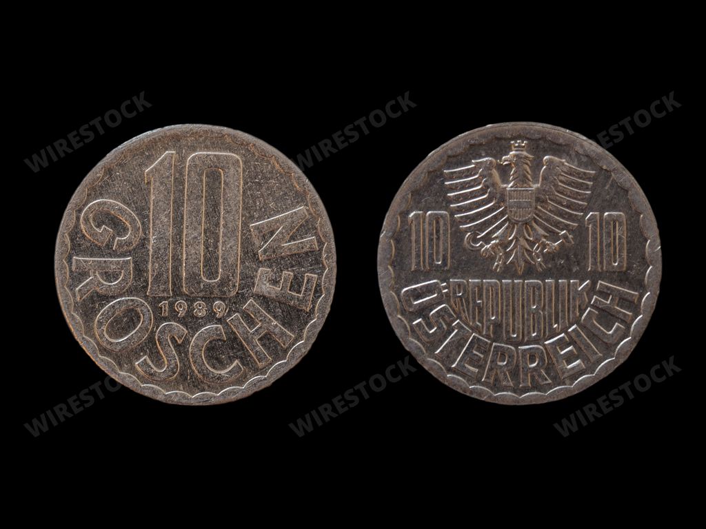 A closeup of an old Austrian schilling coin (10 groschen) isolated on black background
