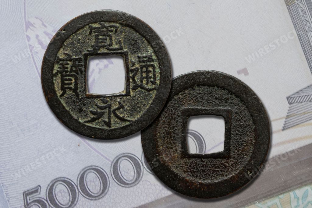 A close-up shot of 17th-century Japanese Mon coins