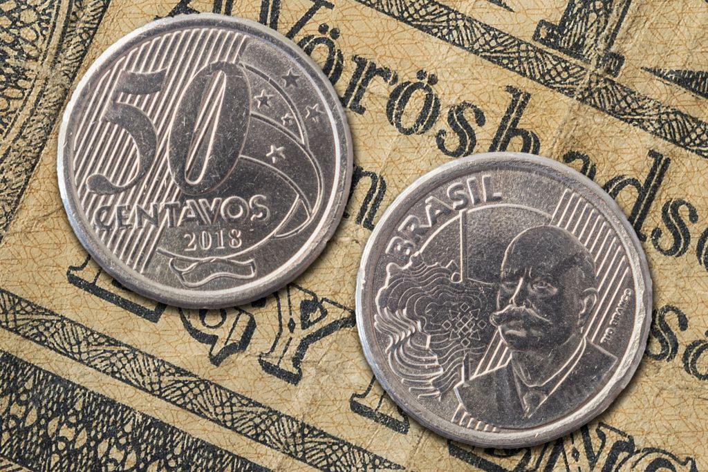 A closeup of a Brazilian 50 centavos coin featuring an image of Rio Branco on one side