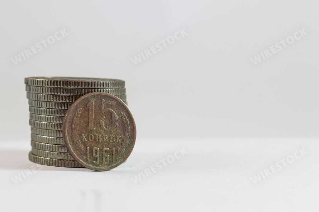 A close-up image of an old USSR kopeck coin, featuring a decorative design on the obverse side and the denomination on the reverse side