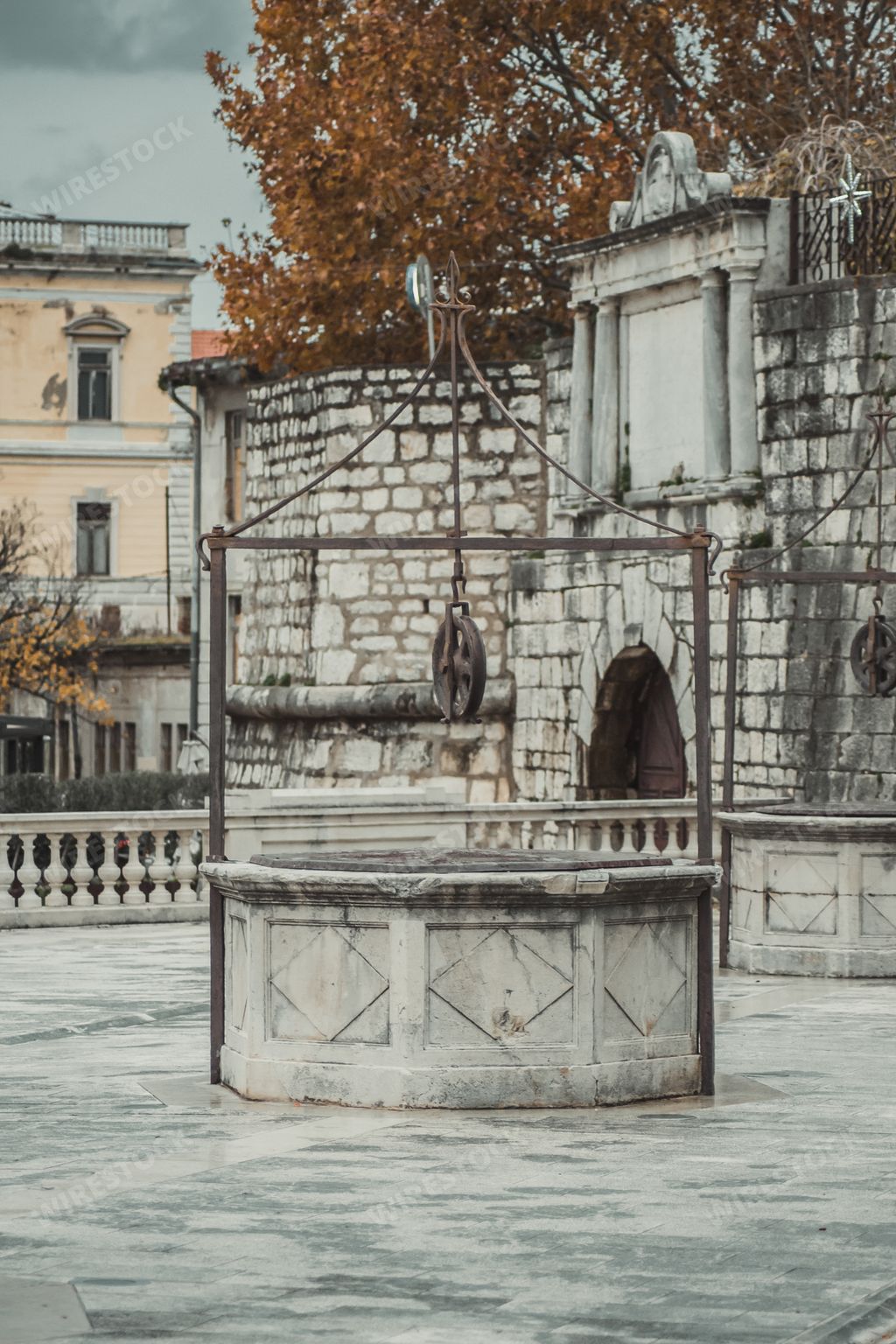 A vertical shot of the historic water well in the five well square in Zadar, Croatia