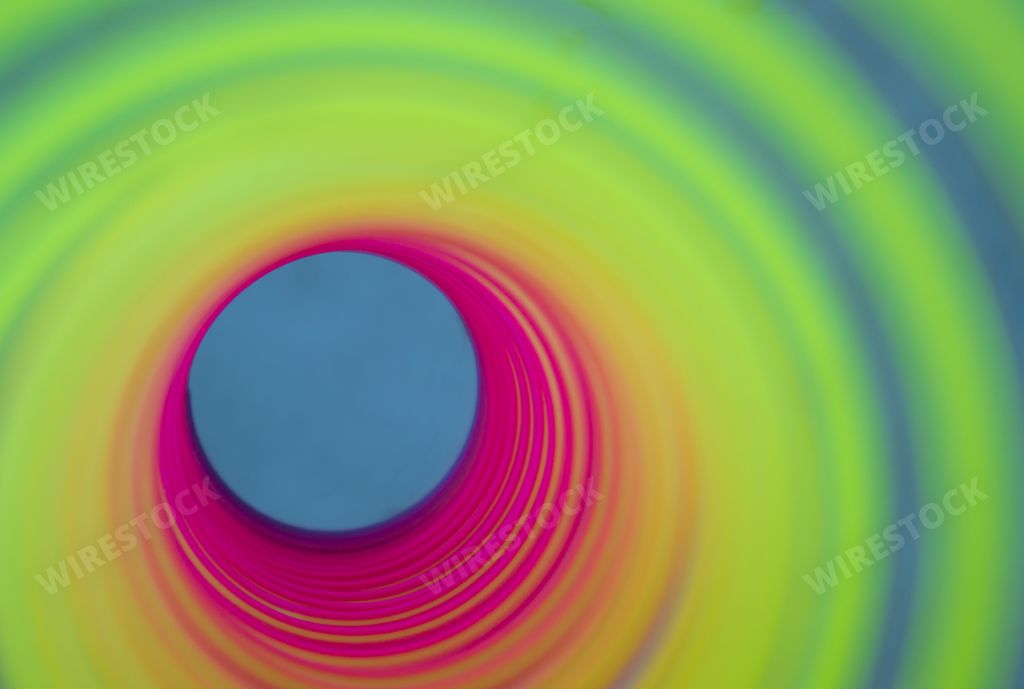 Inside the rainbow-colored plastic spring toy