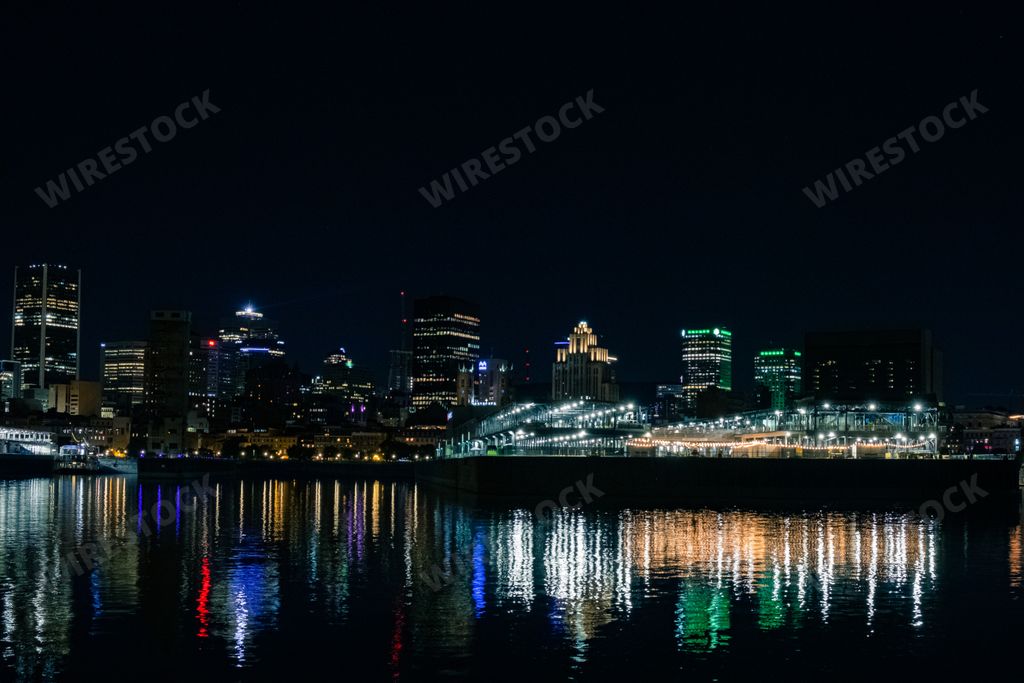 A beautiful Dieppe Park port night skyline with colorful light reflections on the river