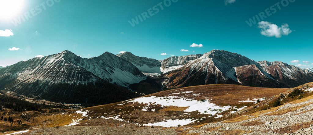A beautiful view of a winter landscape with snow-capped mountains and trees in Canada