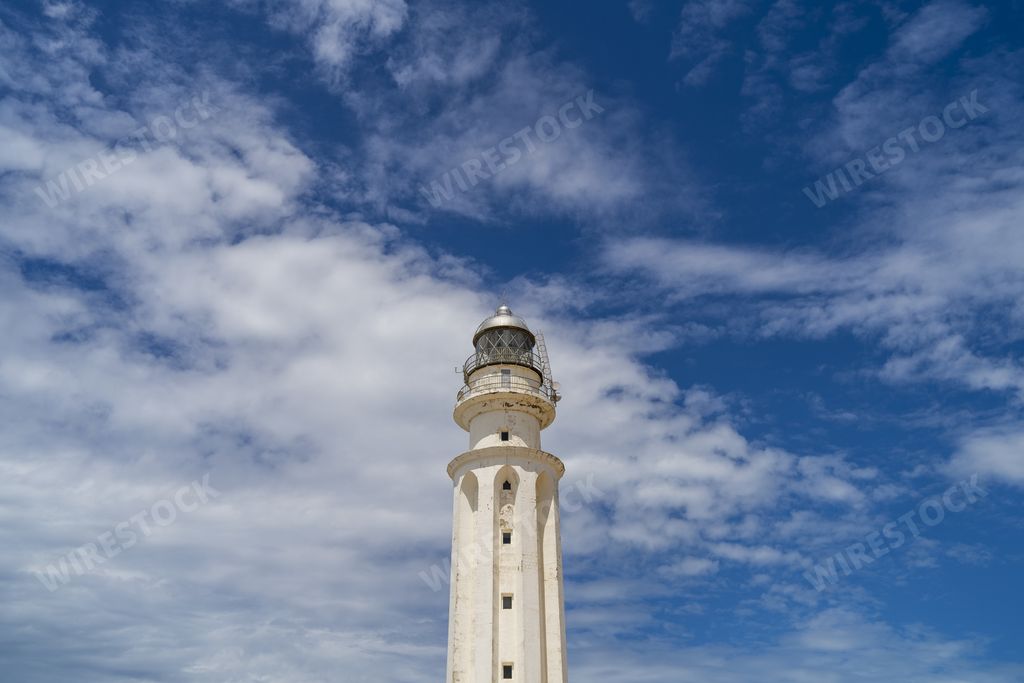 A low angle shot of the lighthouse at Cape Trafalgar under the sunlight at daytime in Spain