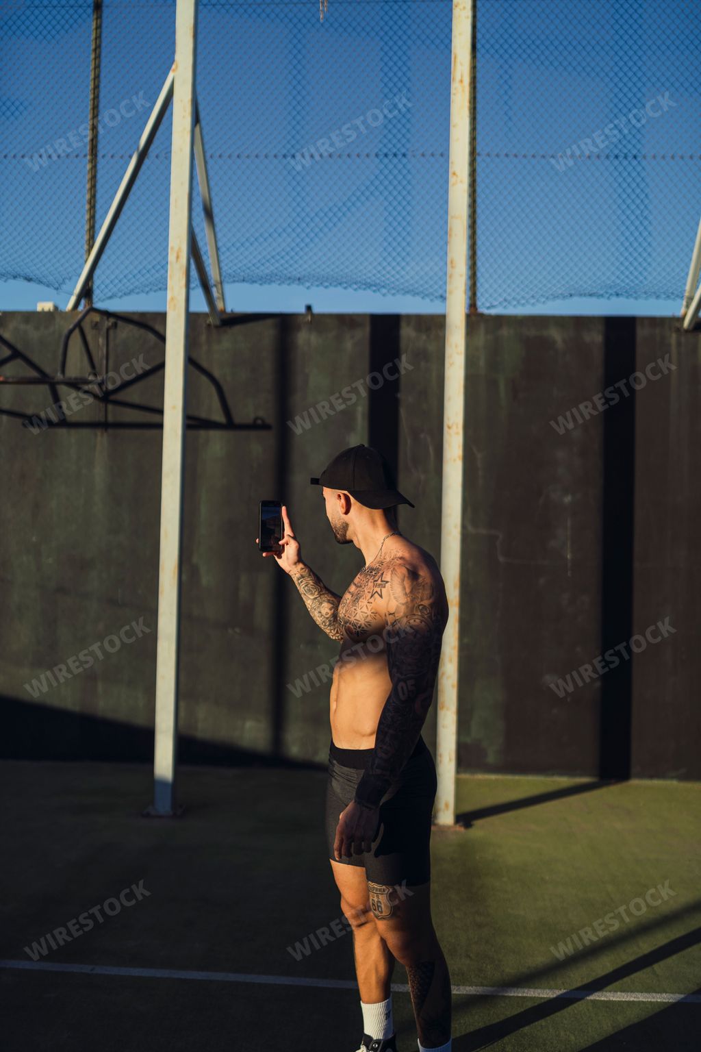 A vertical shot of a young Caucasian male taking a selfie
