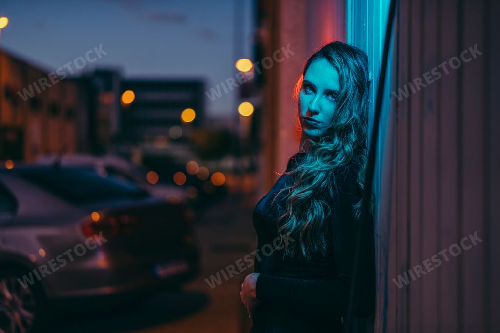 Woman posing in front of window with beautiful lighting
