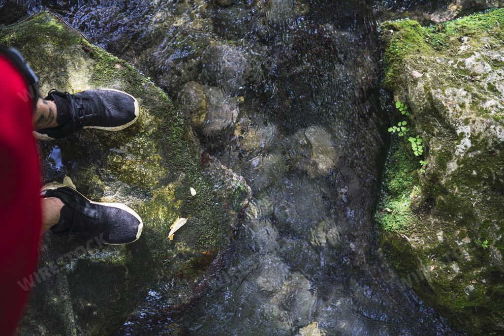 A top view of a young male relaxing near the Majaceite river in Cadiz, Spain