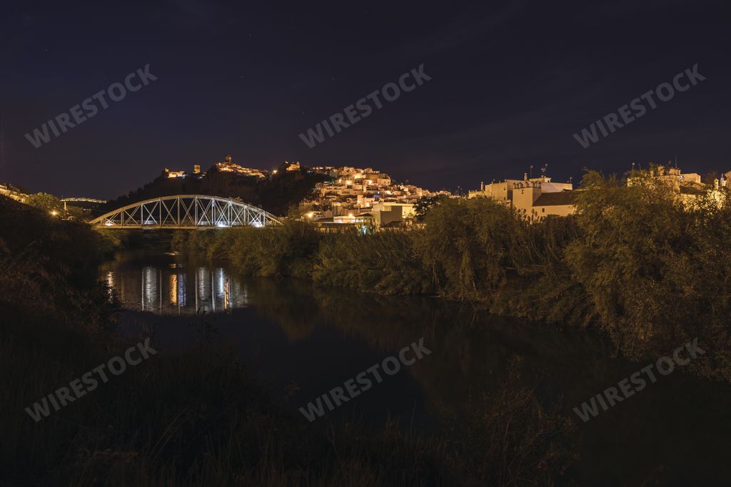 A beautiful shot of an illuminated bridge at night in Andalusia, Spain