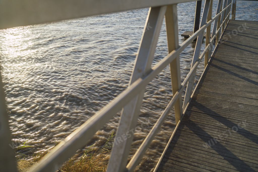 A beautiful view of a pier leading to Guadalquivir river in Trebujena, Cadiz, Spain