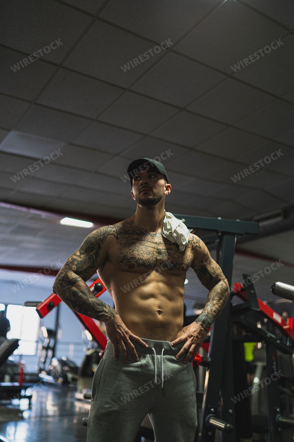 The handsome man doing a workout in the gym