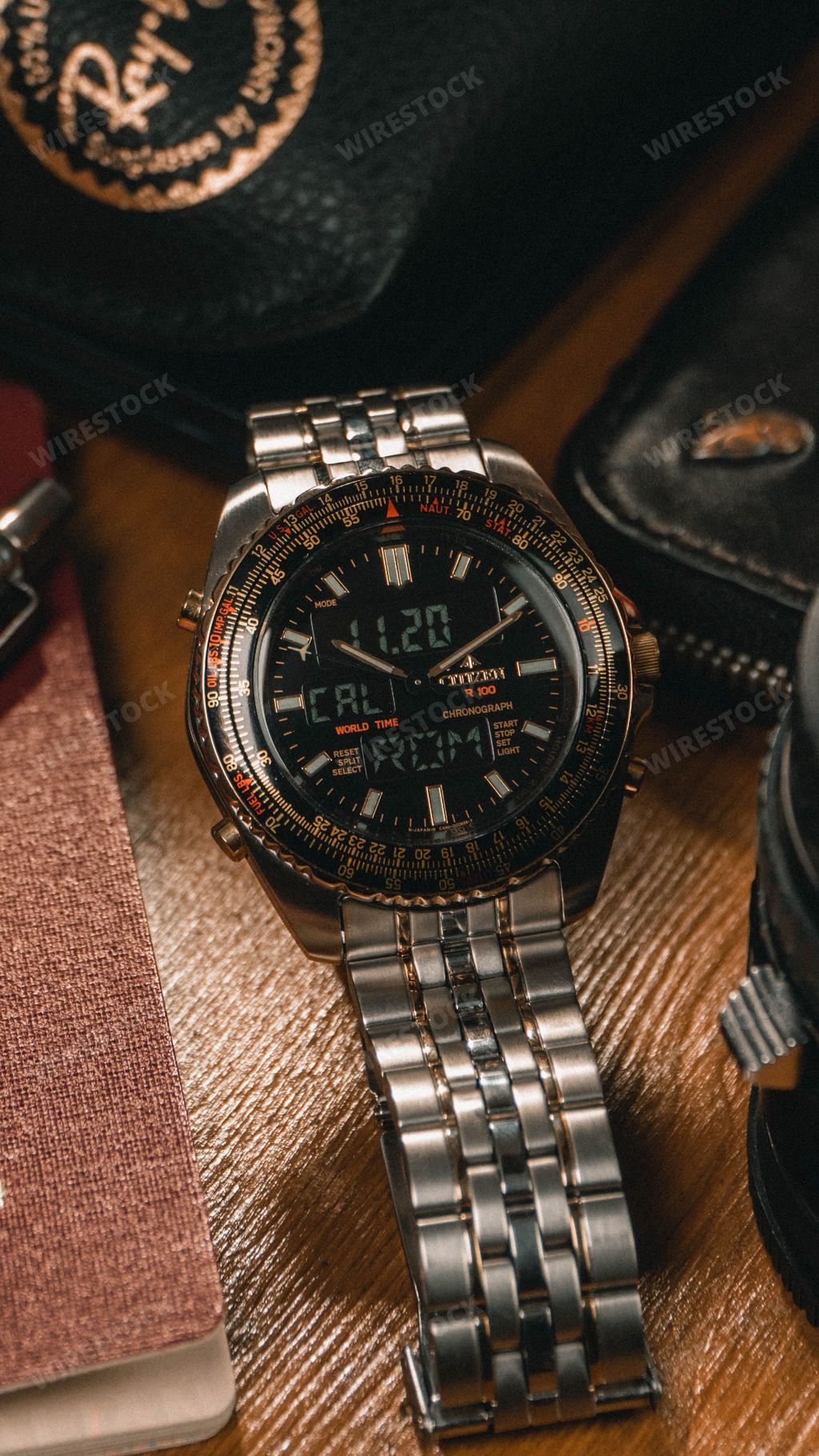 A vertical shot of a 90's pilot Citizen Wingman world timer watch