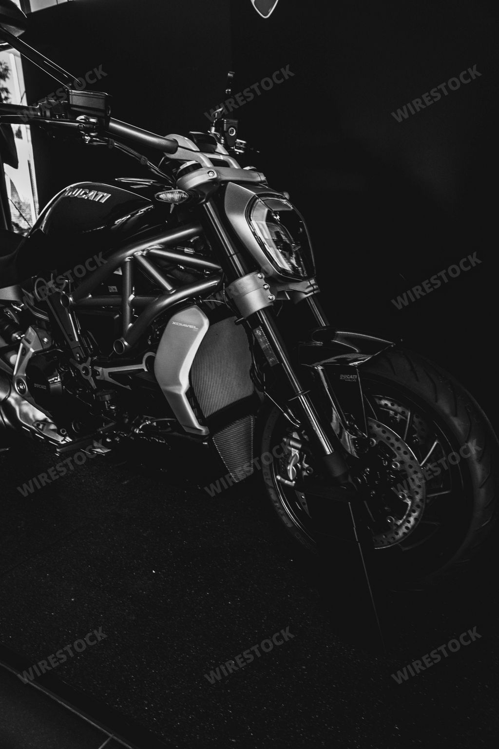 A vertical grayscale shot of Ducati motorcycle, iconic Italian brand