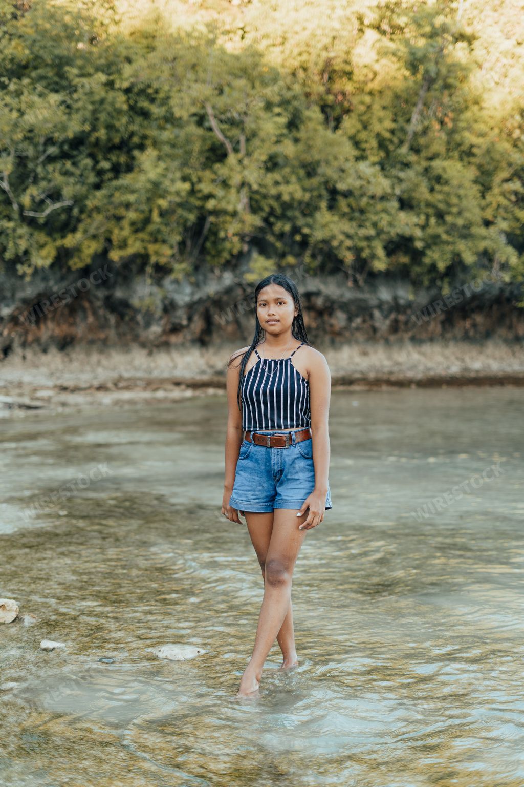 Amazing Portrait of a Beautiful and Cheerful Filipino Asian Teenager Posing on an Exotic Island White Sand Beach in Siargao, Philippines