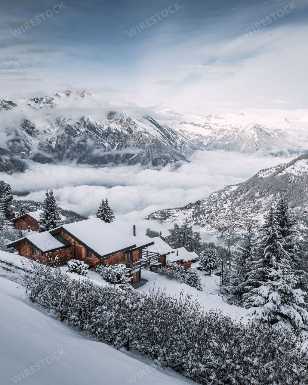 The winter landscape with Swiss chalets covered by snow in La Tzoumaz, Valais, Switzerland