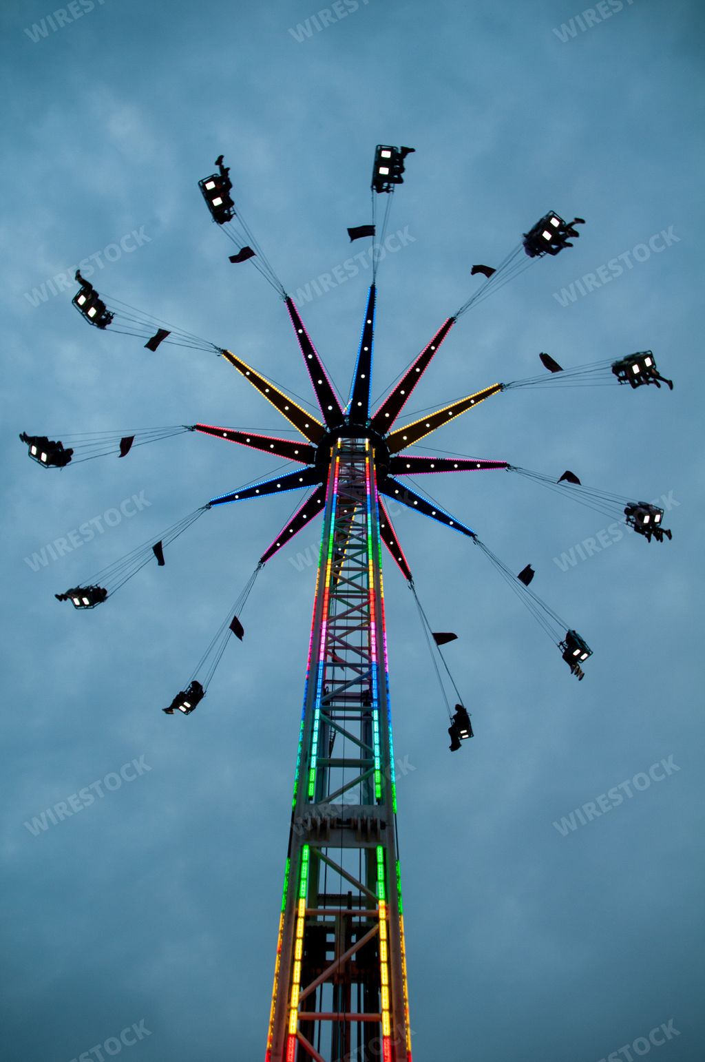 A closeup of the yoyo carnival ride in the evening