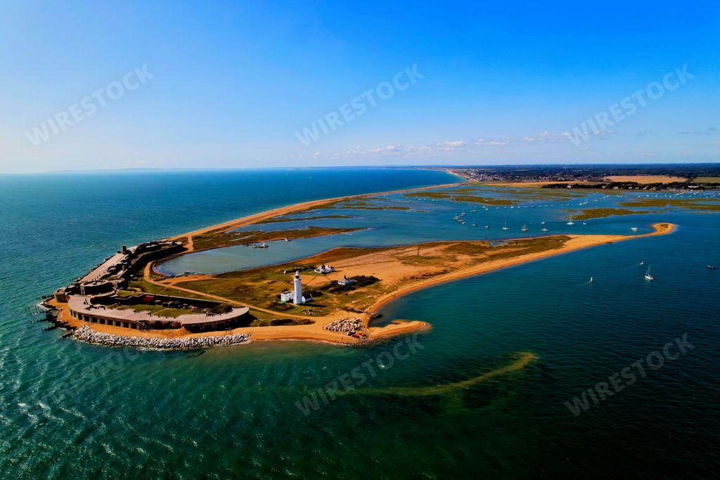 An aerial view of an idyllic tropical island with blue waters in Hurst Spit, UK