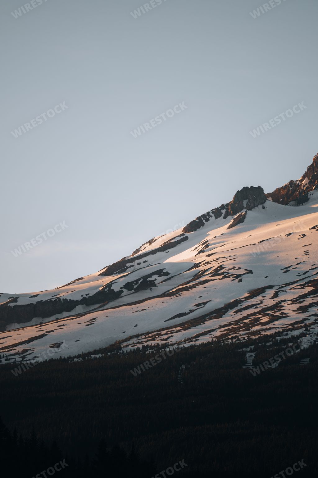 A beautiful view of mountains under the blue sky on a sunny day