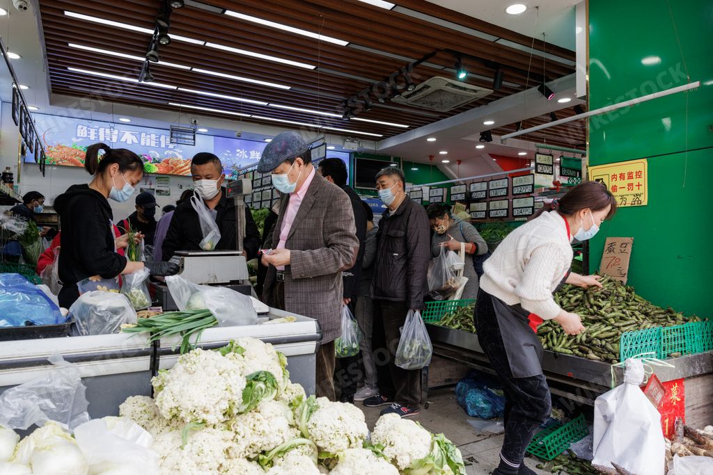 A group of people in a supermarket shopping for essentials in preparation for the lockdown during the COVID19 pandemic