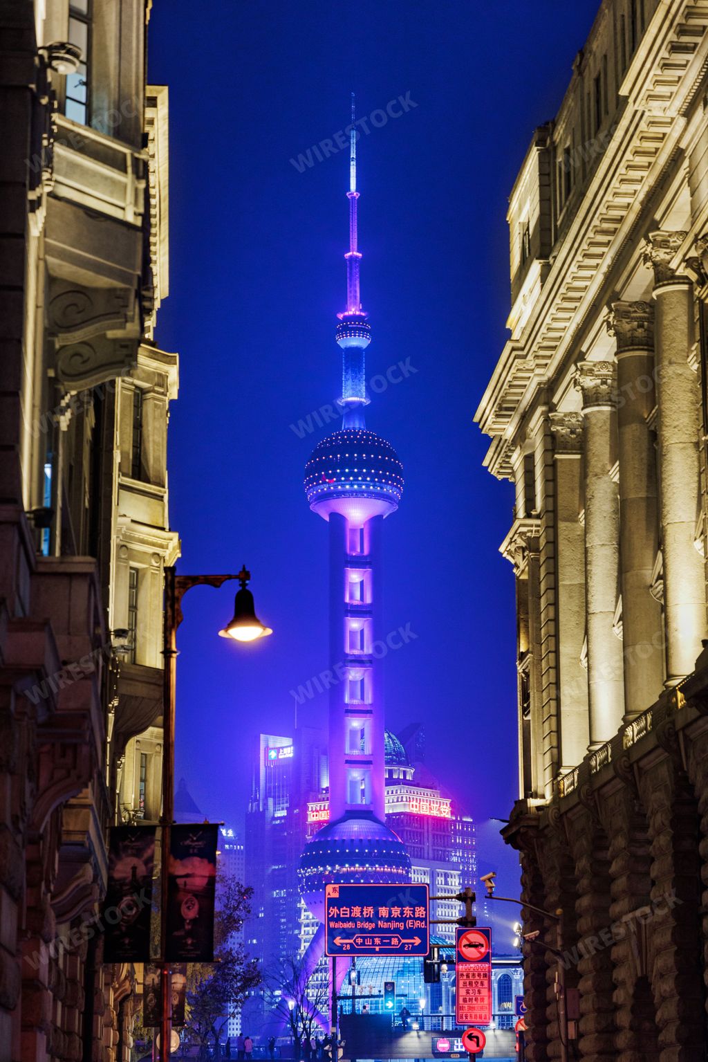 A breathtaking night view of illuminated Pearl Tower in Shanghai, China