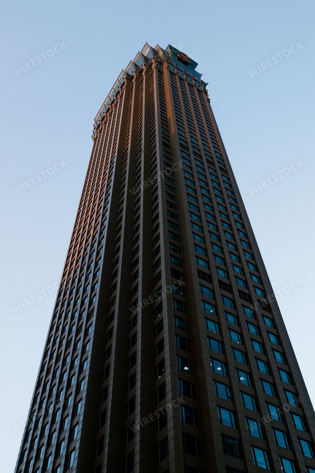 A vertical low-angle shot of a skyscraper in Shanghai, China