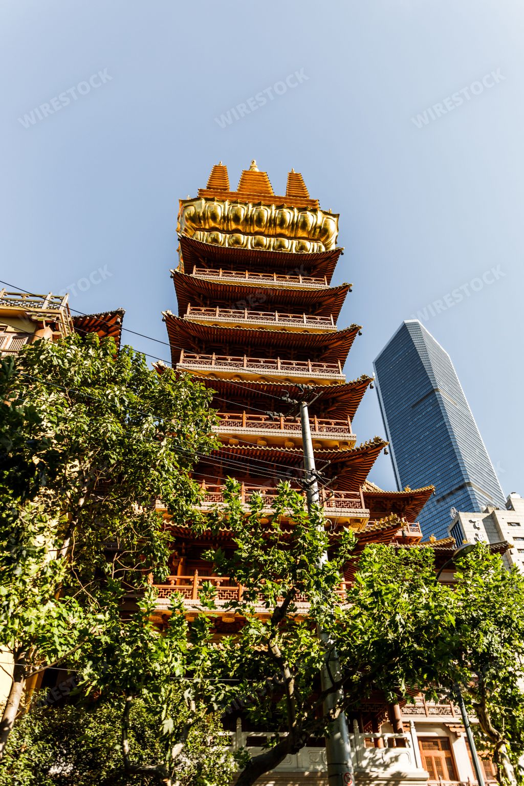 A vertical shot of the Jing'an temple in Shanghai city
